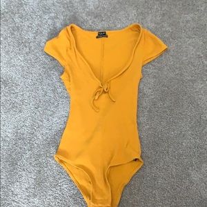 Yellow body suit!